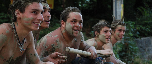 Photo of boys covered in mud