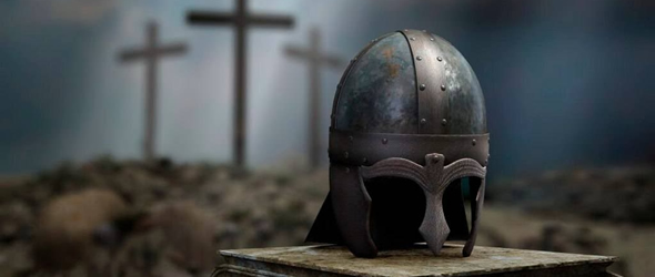 Roman centurion helmet in front of three crosses